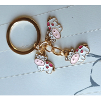 Sleutelhanger met 3 bedels | Goudkleurig, roze | koe
