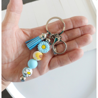 Sleutelhanger met kralen en kwastje | blauw & geel | bloem
