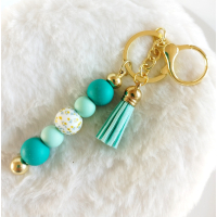 Sleutelhanger met kralen en kwastje | teal, aqua | goudkleurig