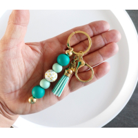 Sleutelhanger met kralen en kwastje | teal, aqua | goudkleurig