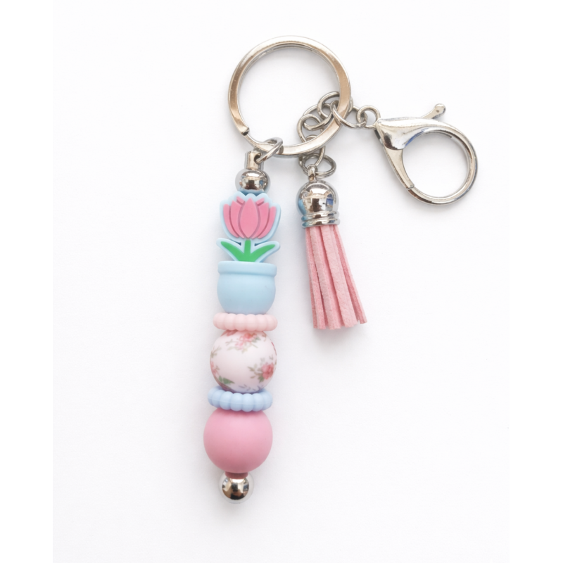 Sleutelhanger met kralen en kwastje | bloem in potje | blauw-roze
