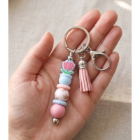 Sleutelhanger met kralen en kwastje | bloem in potje | blauw-roze